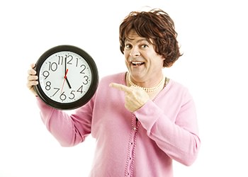 woman holding clock