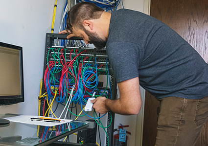Infrastructure Specialist, Ryan, working on our servers